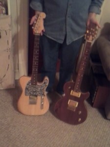 The two electric guitars he made